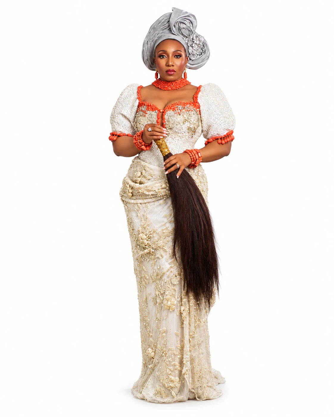 Full-length cream and gold African couture look