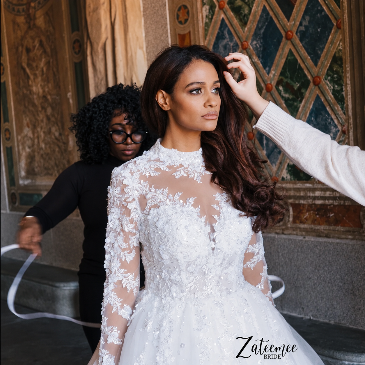 Mercy adjusting a bride’s gown in the atelier